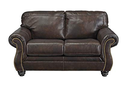 Ashley Furniture Signature Design - Bristan Traditional Style Faux Leather Loveseat with Nailhead Trim - Walnut Brown